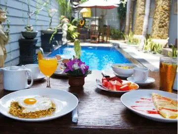You can eat breakfast overlooking the pool at the Sanur Guest House