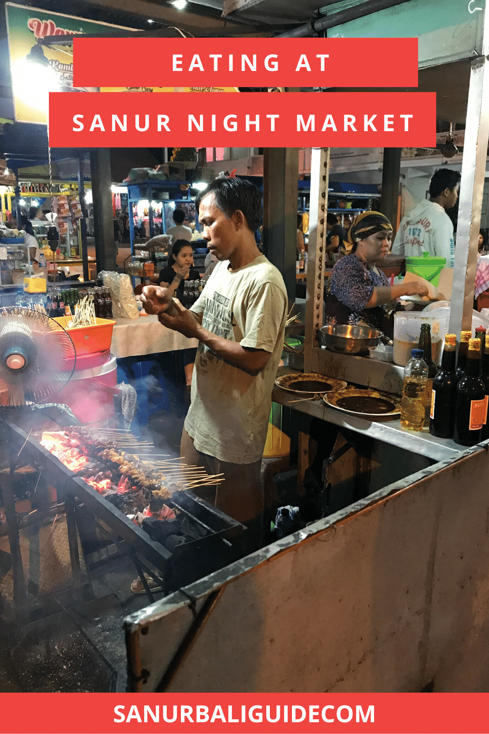 Man cooking chicken satay at Sanur Night Market